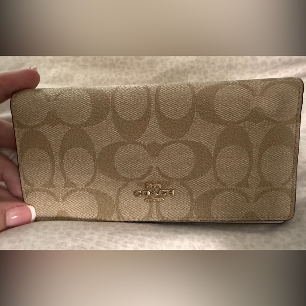 Coach bi-fold wallet or check book holder.